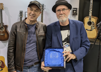 Thomas Ripsam, CEO/President, C.F. Martin & Co. receives the Dealers' Choice Award for 2024 Acoustic Guitar of the Year from MMR publisher Mike Lawson
